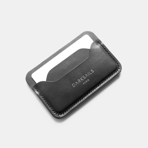 Minimalist leather card holder showing slim profile and card slot access