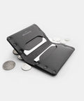 Porte-cartes cuir noir ouvert avec tirette, cartes et pièces