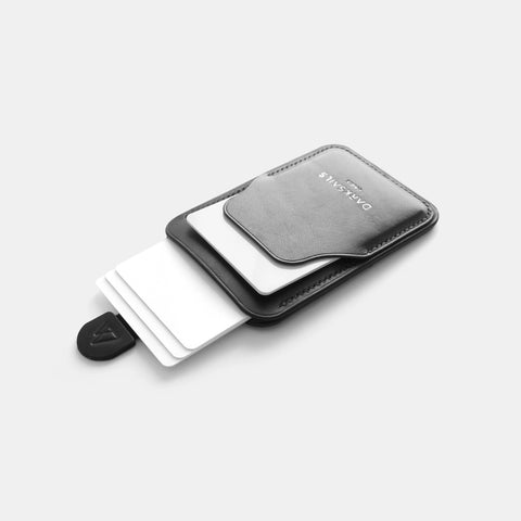 Black leather card holder with pull tab mechanism for quick card access