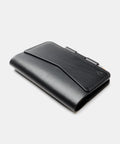 Black leather notebook cover with flap closure and pen lock mechanism