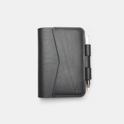 Black leather notebook cover front view with exterior flap pocket
