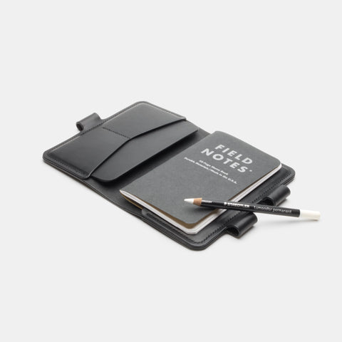 Black leather notebook cover open with card slots and notebook pockets