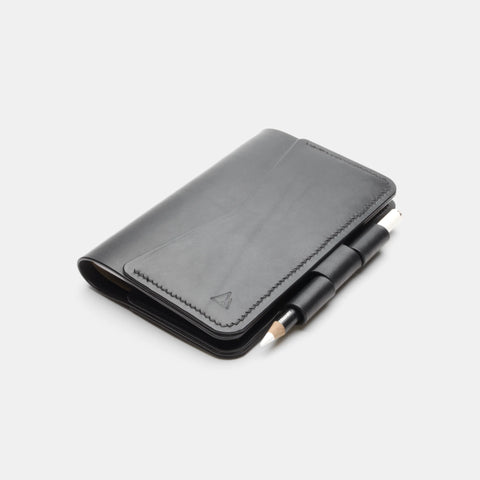 Black leather notebook cover side view with pen holder full-grain leather