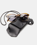 Étui à lunettes de soleil cuir noir à cordon, monture écaille