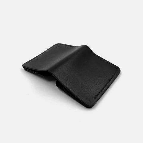 Slim black leather wallet for men closed minimalist profile