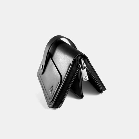 Black leather zip wallet open showing zipper and interior compartments