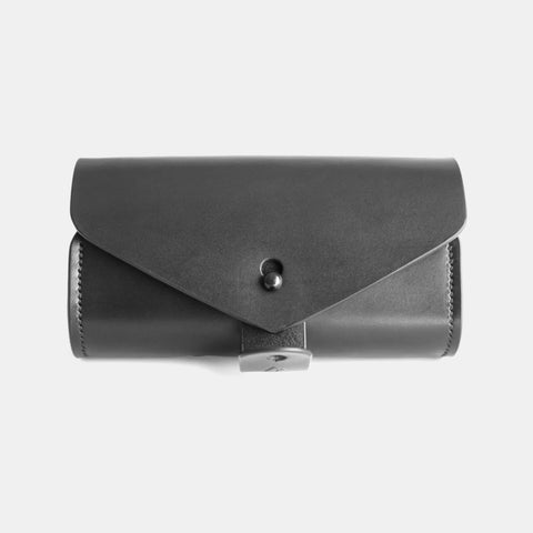 Leather glasses case with strap attachment and reinforced D-rings