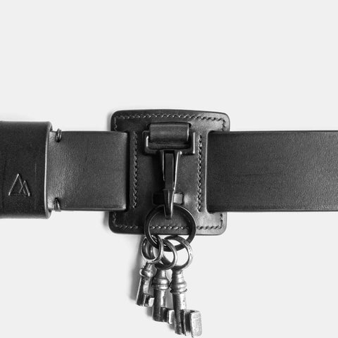 Handmade belt keychain close-up showing saddle stitch craftsmanship