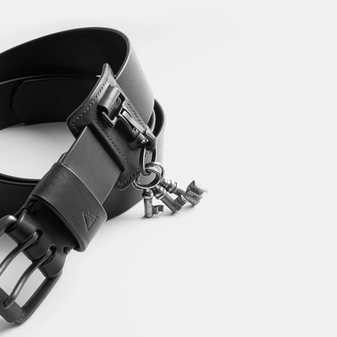 Leather belt keychain attachment mounted on black belt with snap hook