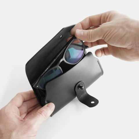 Leather eyeglasses case in use showing easy access and protective interior