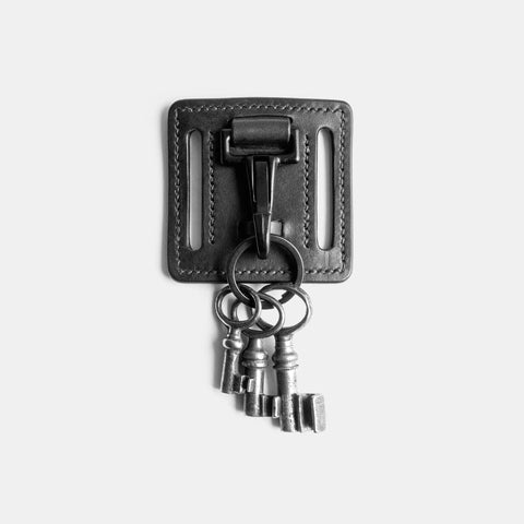 Leather keychain showing dual belt slots and reinforced construction