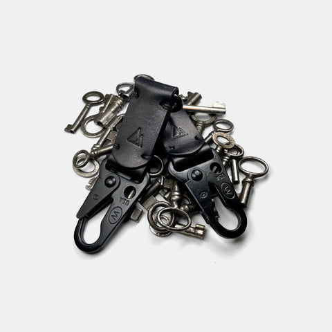 Leather keychain with snap hook holding vintage keys on key ring