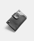 Mens slim leather card holder with minimalist design and rivet reinforcement